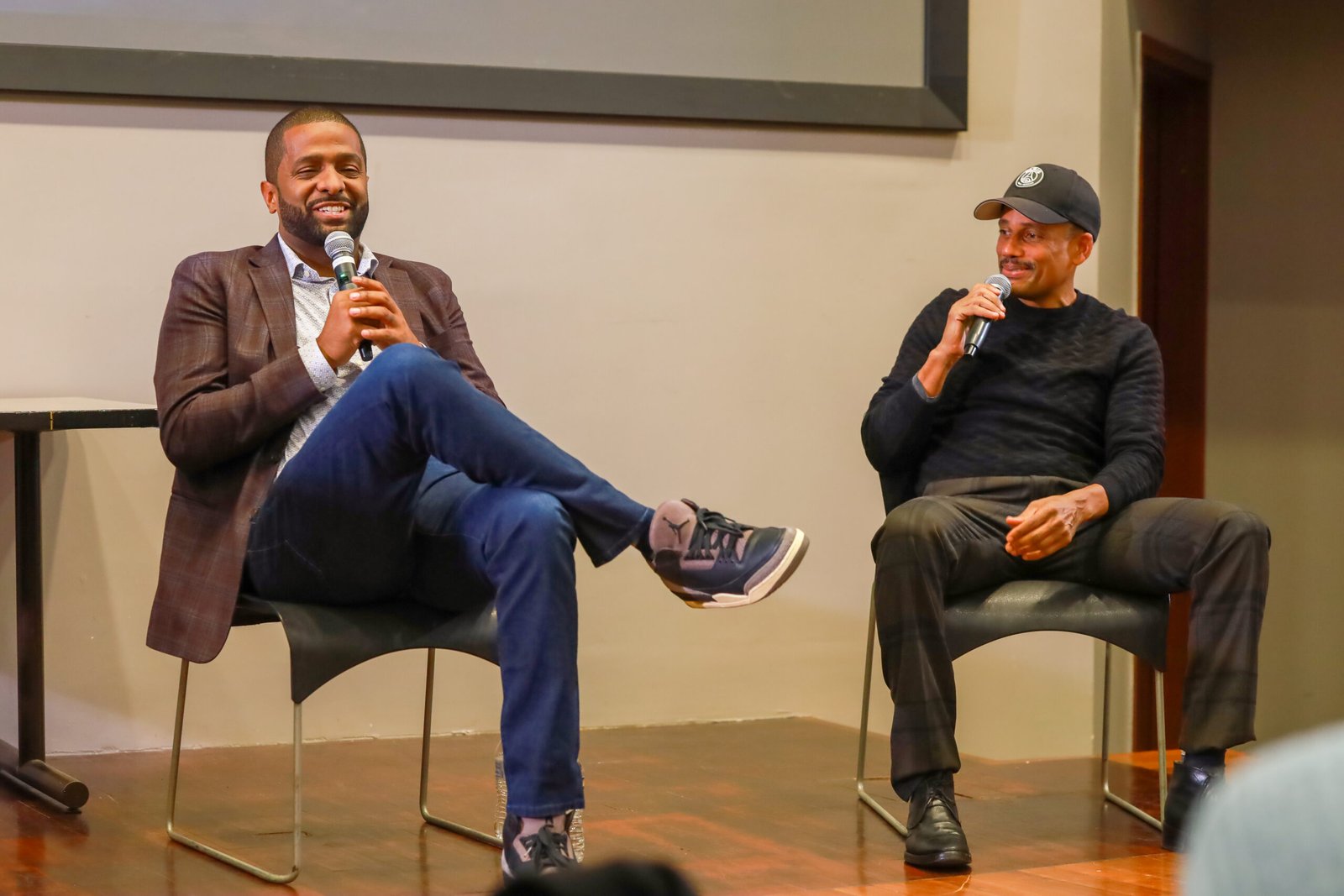 Bakari Sellers and Hill Harper in conversation on stage at the NYC Men Teach Innovation in Education Conference