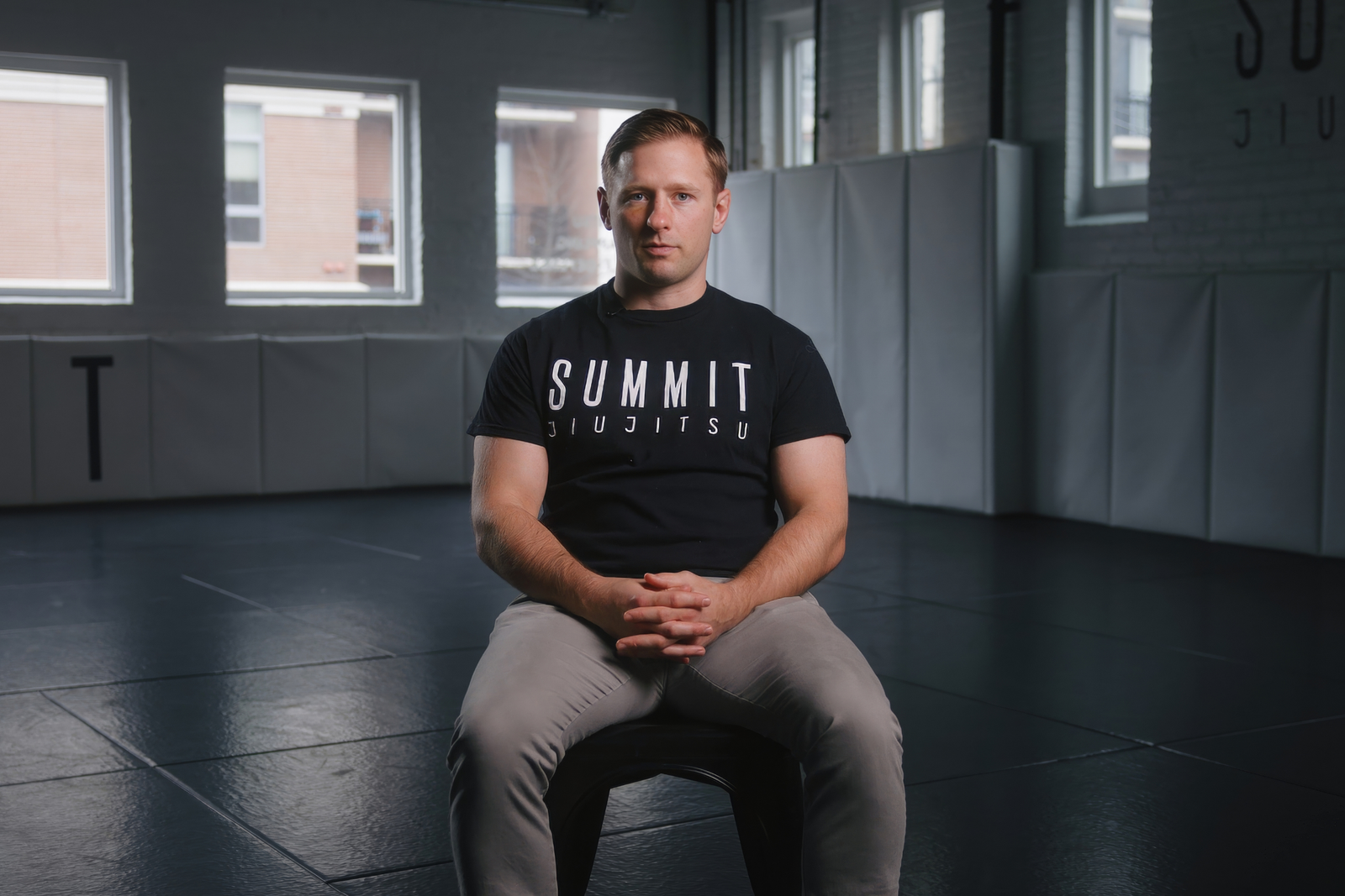 Summit Jiu Jitsu member speaking during a brand film interview inside the academy
